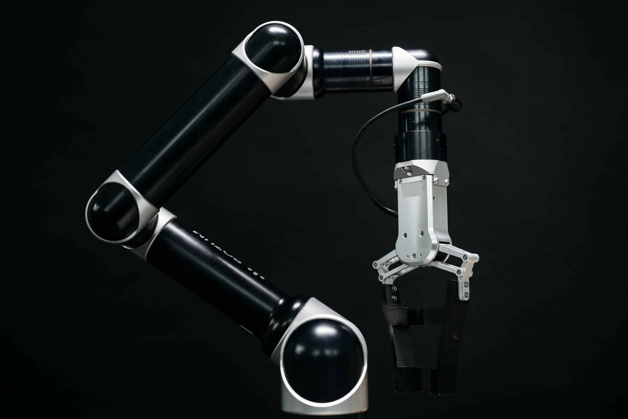 close-up of a mechanical robotic arm with a dark background, showcasing advanced ai technology