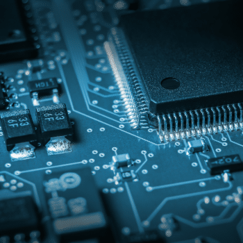 Close-up of a microcontroller chip mounted on an electronic circuit board